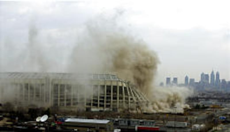 Dust flies up out of Veterans Stadium in Philadelphia as the former home of the Philadelphia Phillies and Philadelphia Eagles implodes Sunday.