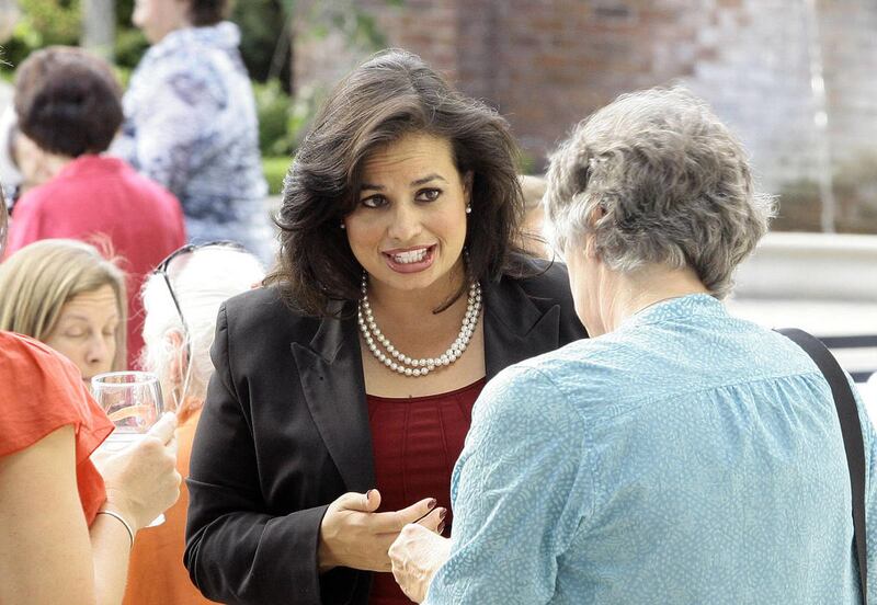 Candidate Celina Milner talks with supporters during a fundraising event for the six hispanic women candidates for the state legislature, in Salt Lake City Tuesday, August 28, 2012