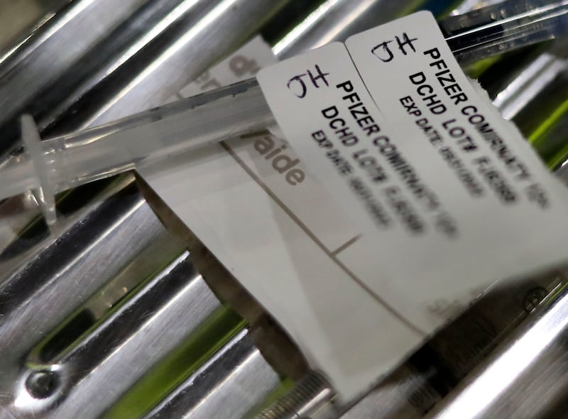 Syringes loaded with the Pfizer COVID-19 vaccine at a drive-thru COVID-19 vaccination clinic in Farmington.