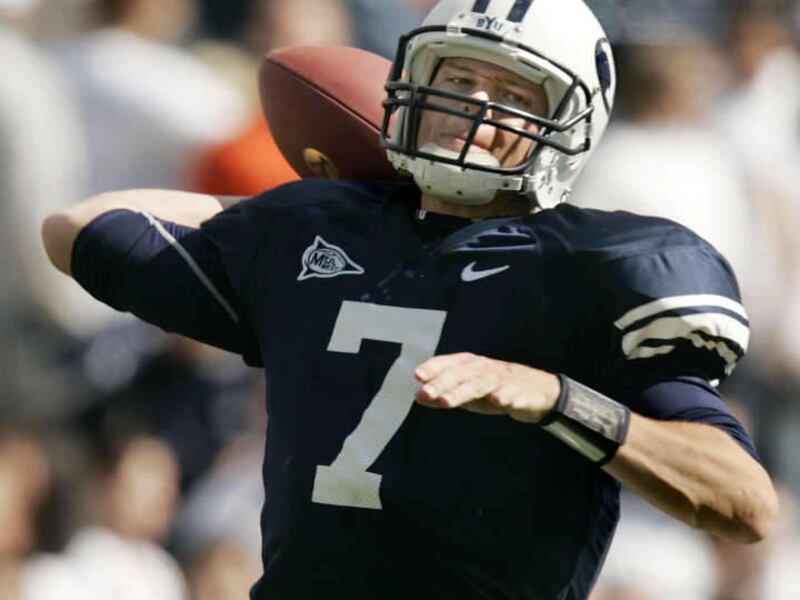 In this 2006 file photo, Brigham Young quarterback Jason Beck passes against Utah State during the fourth quarter of a college football game in Provo, Utah. Bronco Mendenhall's hire of Beck as QB coach is a smart move, according to former BYU quarterback