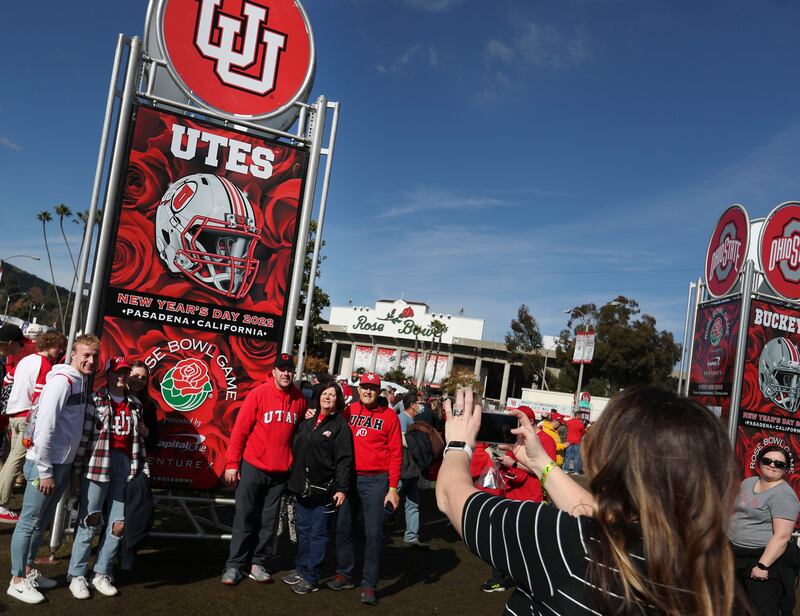 Utah fans take photos before Utah and Ohio State compete in the 108th Rose Bowl game in Pasadena, Calif., Jan. 1, 2022.