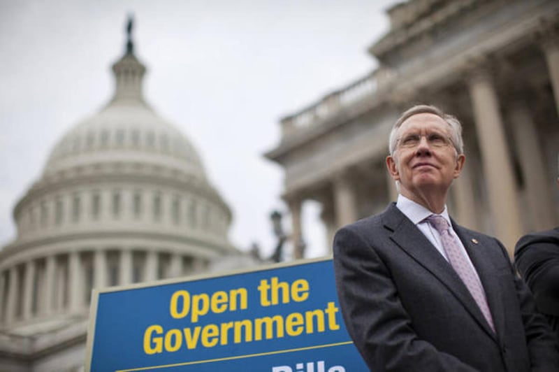 Senate Majority Leader Harry Reid of Nev., a liberal Democrat and a Mormon, stands on the Senate steps on Capitol Hill in Washington, Wednesday, Oct. 9, 2013, during a news conference.