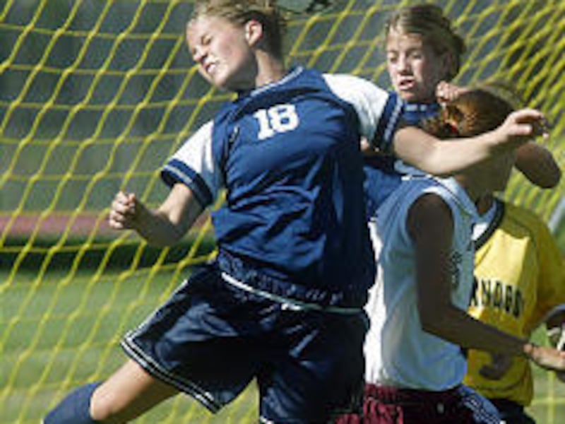 Timpanogos' Kelli Hegerhorst (18) tries heading the ball into the goal Thursday, but her shot did not go past the Mountain View goalie.
