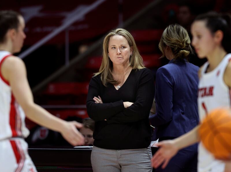 Utah Utes women’s basketball coach Lynne Roberts strategizes during a timeout in the game against the Colorado Buffaloes.