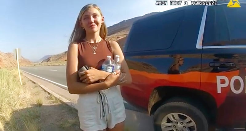 Gabrielle “Gabby” Petito talks to a police officer near the entrance to Arches National Park.