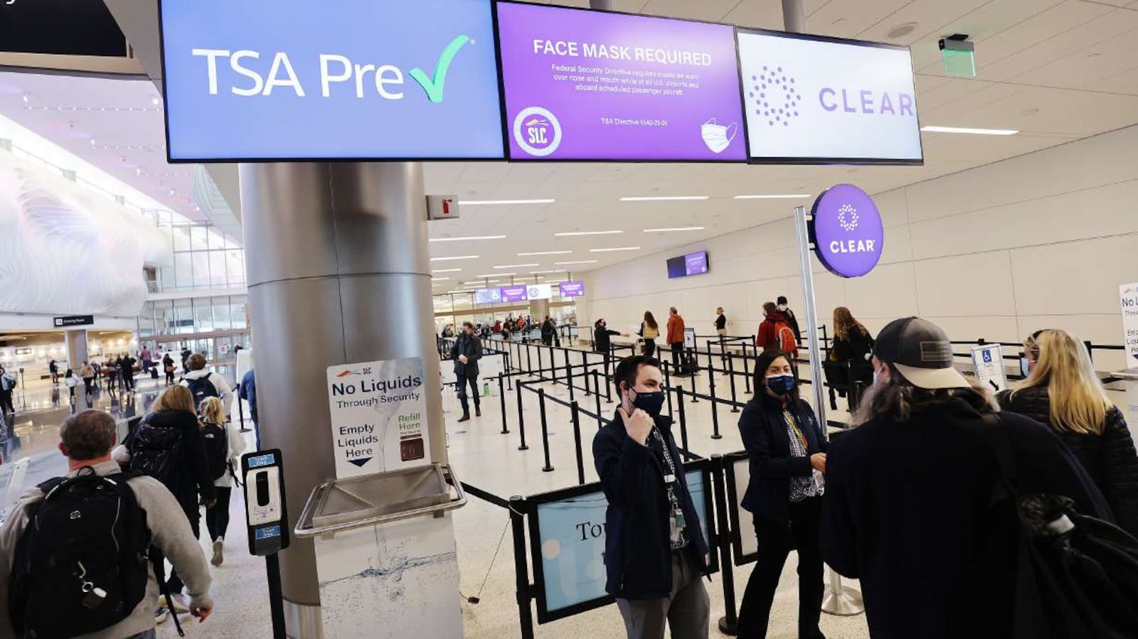 Travelers enter security at Salt Lake City International Airport on Dec. 22, 2021.