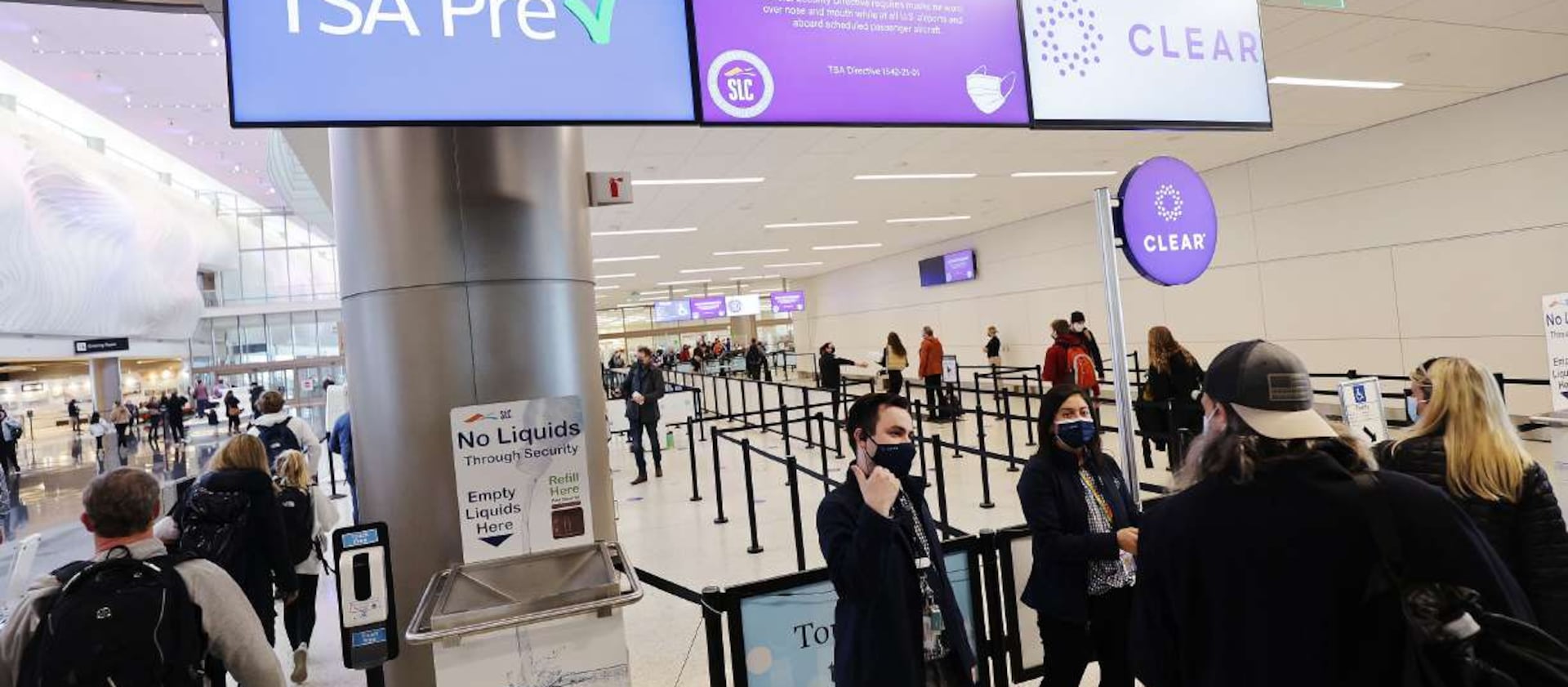 Travelers enter security at Salt Lake City International Airport on Dec. 22, 2021.
