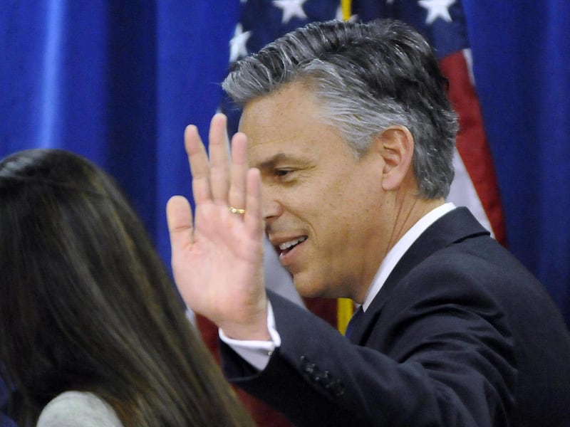 GOP Presidential canidate Jon Huntsman waves goodbye to the media after announcing he is withdrawing from the race and backing Mitt Romeny, in a press conference, Monday, Jan. 16, 2012 at the Myrtle Beach Convention Center in Myrtle Beach, S.C.