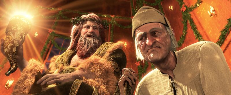 Left to right: Ghost of Christmas Present, Ebenezer Scrooge (JIM CARREY) in "Disney's A Christmas Carol."