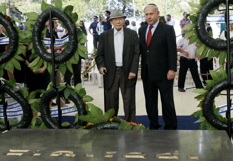 FILE - In this July 11, 2010 file photo Israeli Prime Minister Benjamin Netanyahu, right, and his father Benzion attend the official memorial service for the late Zionist leader Ze'ev Jabotinsky at the Mt. Herzl cemetery in Jerusalem. Benzion Netanyahu,