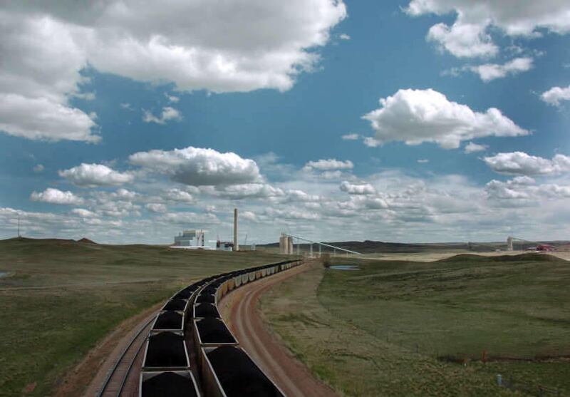 In this Thursday, April 29, 2010 file photo, a pair of coal trains idle on the tracks near Dry Fork Station, a coal-fired power plant being built by the Basin Electric Power Cooperative near Gillette, Wyo.