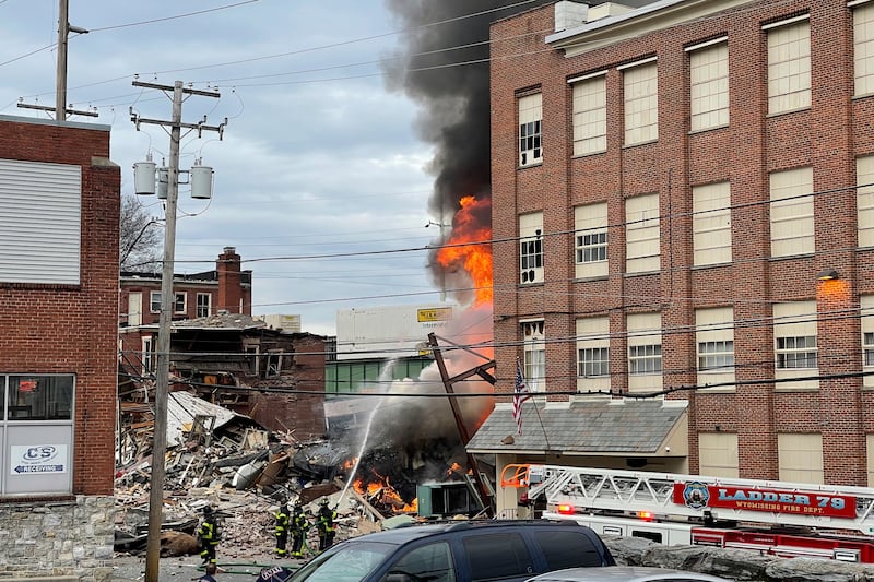 Emergency personnel work at the site of a deadly explosion at a chocolate factory in West Reading, Pa., Friday, March 24, 2023.