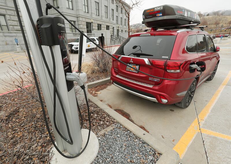 An electric vehicle is charged at the Capitol in Salt Lake City on Tuesday, Dec. 31, 2019.