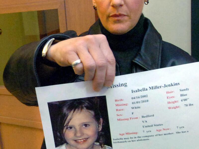 FILE - In this Feb. 23, 2010 file photo, Janet Jenkins, of Fair Haven, Vt., involved in a same-sex custody battle with Lisa Miller, holds up a photo of her daughter, Isabella, for television cameras in Rutland, Vt. Miller and her daughter Isabella avoid