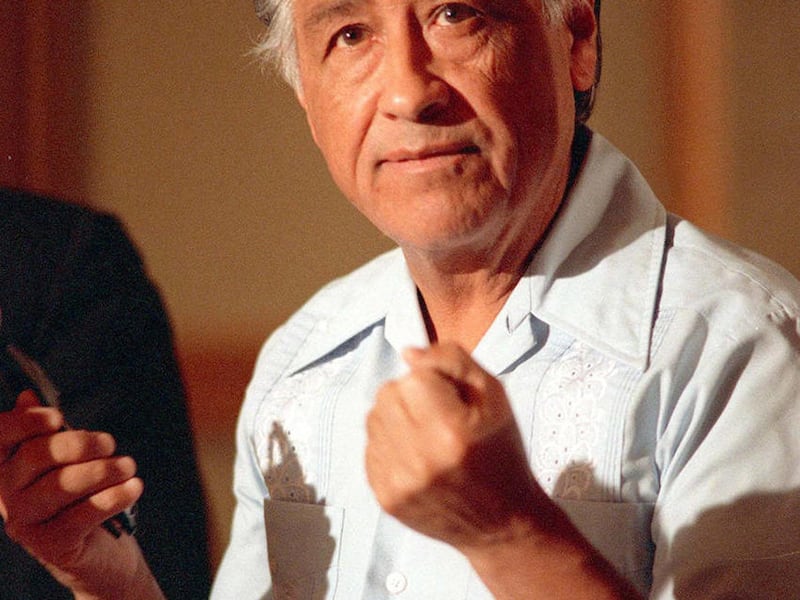 In this March 8, 1989 file photo, Cesar Chavez gestures as he speaks during a news conference in Los Angeles.