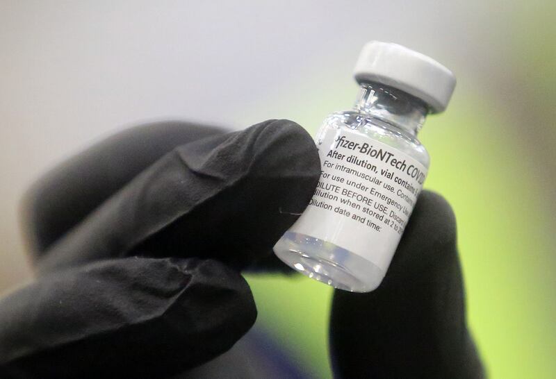 A vial of the Pfizer-BioNTech COVID-19 vaccine is pictured at the Legacy Center Indoor Arena in Farmington.