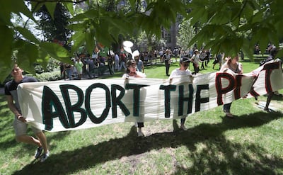 Protesters walk to the Chamber of Commerce Building at 175 E. 400 South in Salt Lake City on Tuesday, July 9, 2019. The protest over the Utah Inland Port began at the City-County Building and moved to the Chamber of Commerce Building where the port author