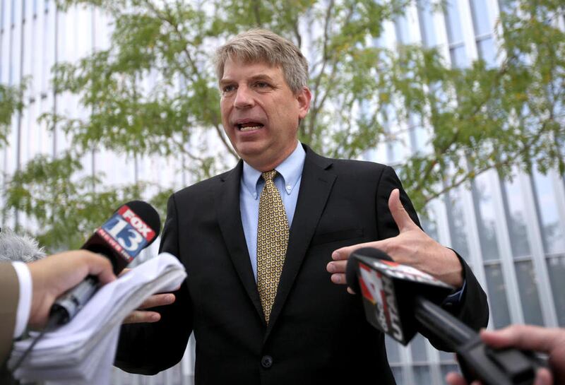 FILE - United Utah Party third congressional district candidate Jim Bennett talks to the media outside of the Federal Courthouse in Salt Lake City on Thursday, Aug. 3, 2017.