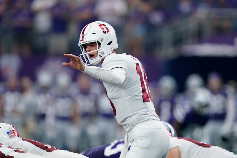 Stanford quarterback Tanner McKee signals at the line of scrimmage