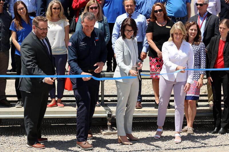 Thom Carter, Gov. Spencer Cox’s energy adviser, left, Bryon Stock, general manager of the Chevron Salt Lake Refinery, Lt. Gov. Deidre Henderson, and Rep. Melissa Garff Ballard, R-North Salt Lake, cut a ribbon to celebrate the completion of the worldâ??s first commercial ionic liquids alkylation unit at the Chevron Salt Lake Refinery in Salt Lake City on Monday, June 7, 2021.