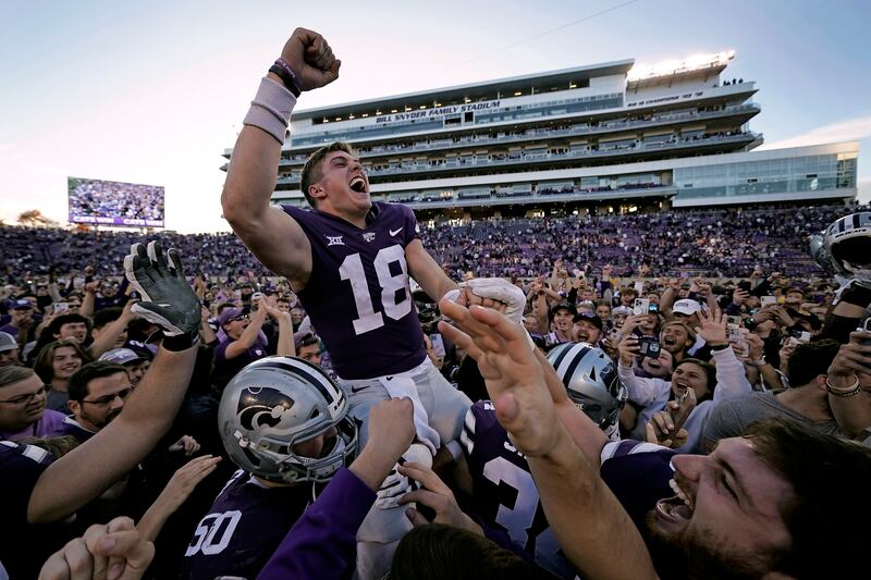 Kansas State QB Will Howard celebrates as he is carried off the field by teammates after defeating Oklahoma State.