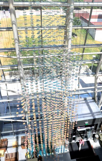 A glass sculpture hangs from the ceiling in the entryway of the Health Sciences Education Building in Salt Lake City on Tuesday, July 17, 2018.