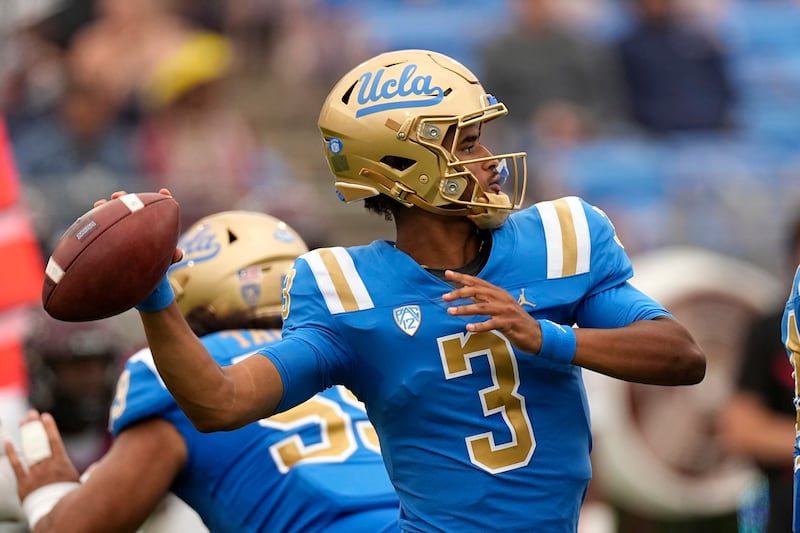 UCLA quarterback Dante Moore passes
