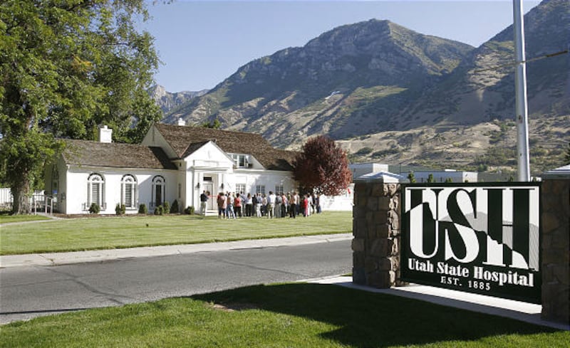 Visitors gather Tuesday in front of Old Superintendent's Home at the Utah State Hospital. The home now serves as the hospital museum.