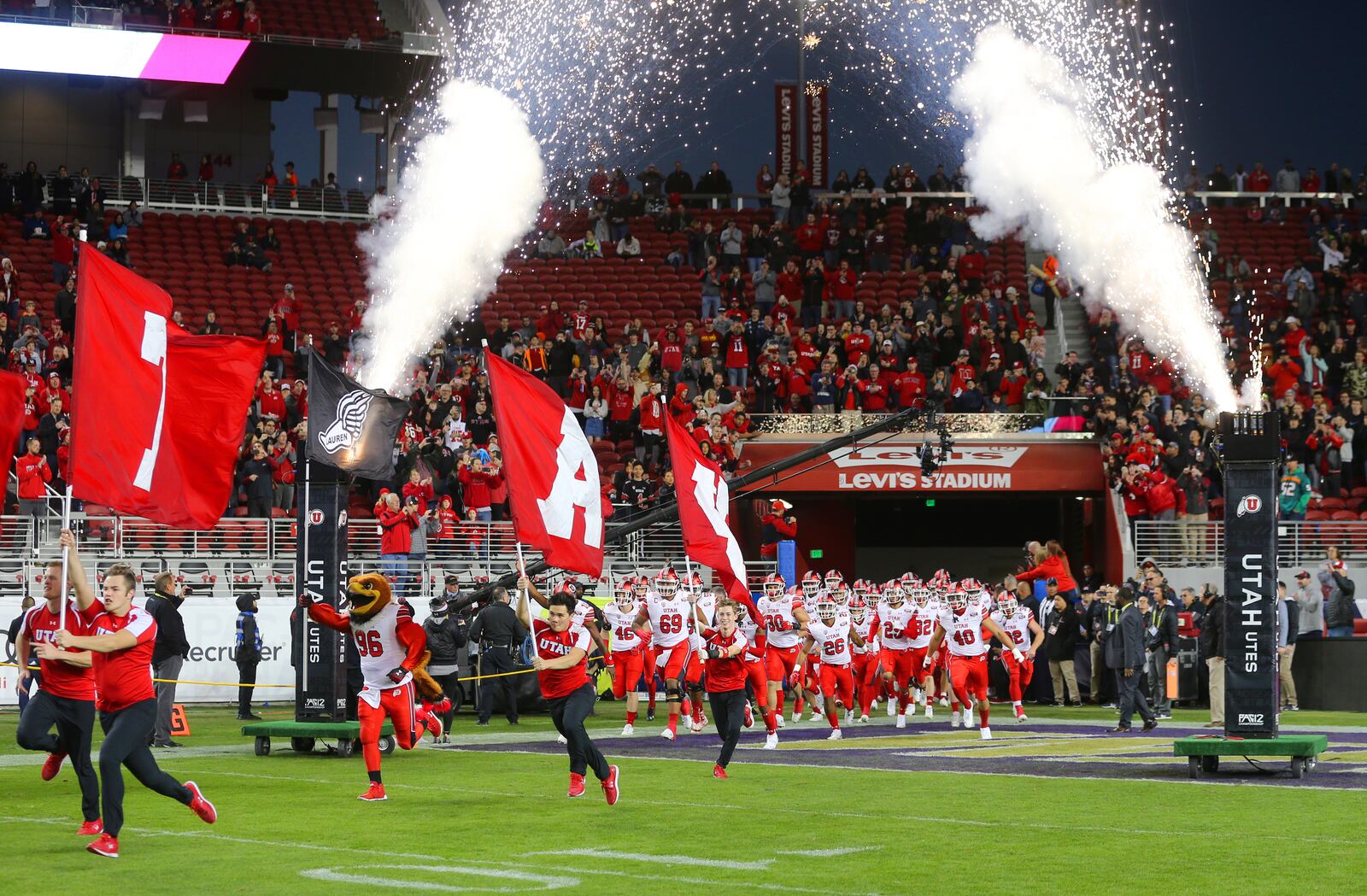 Utah runs onto the field as they and Washington play in the Pac-12 Championship game at Levi’s Stadium in Santa Clara on Friday, Nov. 30, 2018.