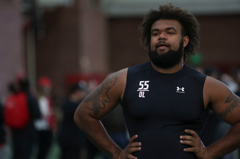 Former Utah football player Nick Ford stands