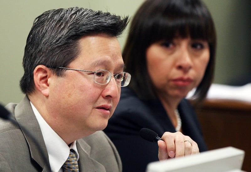 FILE - Rep. Dean Sanpei, R-Provo, speaks as the Economic Development and Workforce Services Interim Committee discusses impacts of exempting Utah from daylight saving time in Salt Lake City, on Wednesday, Oct. 15, 2014. In the background is Rep. Angela Ro
