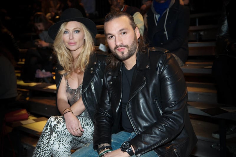 In this Feb. 11, 2014 file photo, Isabel Adrian and Steve Angello, right, attend EN|NOIR Fall/Winter 2014 Runway Show at Park Avenue Armory in New York. Angello announced Friday, March 7, 2014, that his Size Records will roll out more than 170 songs for f