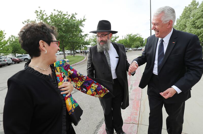 Rabbi Benny Zippel, founder and executive director of Chabad Lubavitch of Utah, talks with Elder Dieter F. Uchtdorf of Quorum of the Twelve Apostles, and his wife, Sister Harriet Uchtdorf, during a 25th anniversary gala celebration for Chabad Lubavitch of