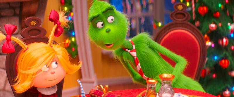 FILE - This file image released by Universal Pictures shows the characters Cindy-Lou Who, voiced by Cameron Seely, left, and Grinch, voiced by Benedict Cumberbatch, in a scene from "The Grinch." “Dr. Seuss’ The Grinch” made off with $66 million for Univer