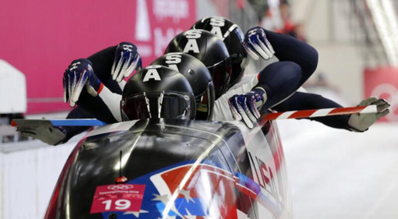 Driver Justin Olsen, Christopher Fogt, Carlo Valdes and Nathan Weber of the United States start their third heat during the four-man bobsled competition final at the 2018 Winter Olympics in Pyeongchang, South Korea, Sunday, Feb. 25, 2018.