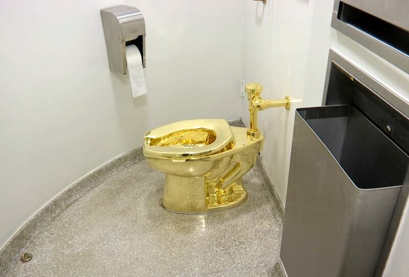 This 2016 file image made from a video shows the 18-karat toilet, titled “America,” by Maurizio Cattelan in the restroom of the Solomon R. Guggenheim Museum in New York.