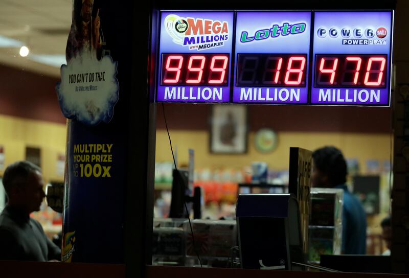 A sign displays the estimated Mega Millions jackpot at a convenience store in Chicago, Friday, Oct. 19, 2018. Friday's jackpot has soared to $1 billion, the second-largest prize in U. S. lottery history.