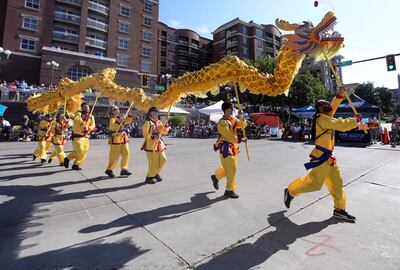 Sil Lum Kung Fu Kwoon lion head dancers perform in the Days of ’47 Parade in Salt Lake City on Tuesday, July 24, 2018.