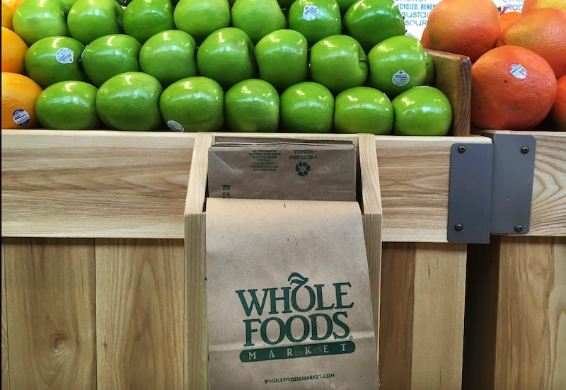 In this Saturday, July 15, 2017, photo, fruit is stacked in bins in the produce section of the Whole Foods Market in Sudbury, Mass.