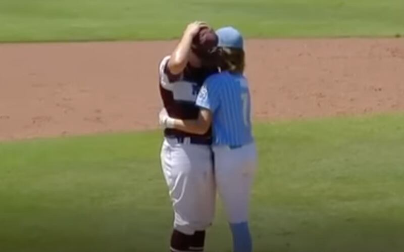 Isaiah Jarvis of Oklahoma’s Little League team hugs pitcher Kaiden Shelton of Texas East-Pearland after Shelton accidentally hit him with a pitch.