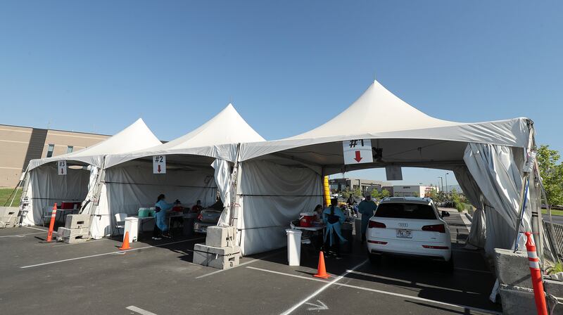 University of Utah Health workers test for COVID-19 in Farmington on Friday, July 31, 2020. U of U Health is using cooling methods at its testing stations to keep employees comfortable during the extreme heat.