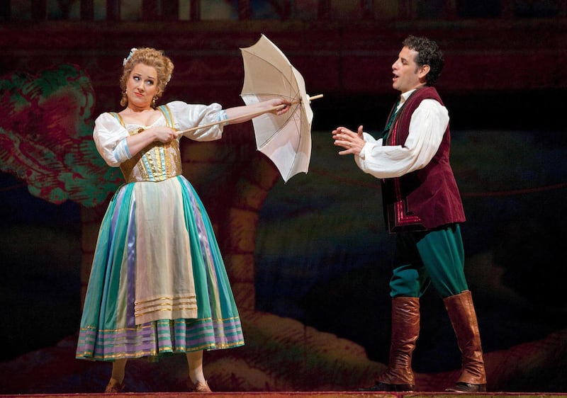 In this March 1, 2012, photo provided by the Metropolitan Opera, Diana Damrau performs as Adina and Juan Diego FlÓrez as Nemorino in Donizetti's "L'Elisir d'Amore," at the Metropolitan Opera in New York.
