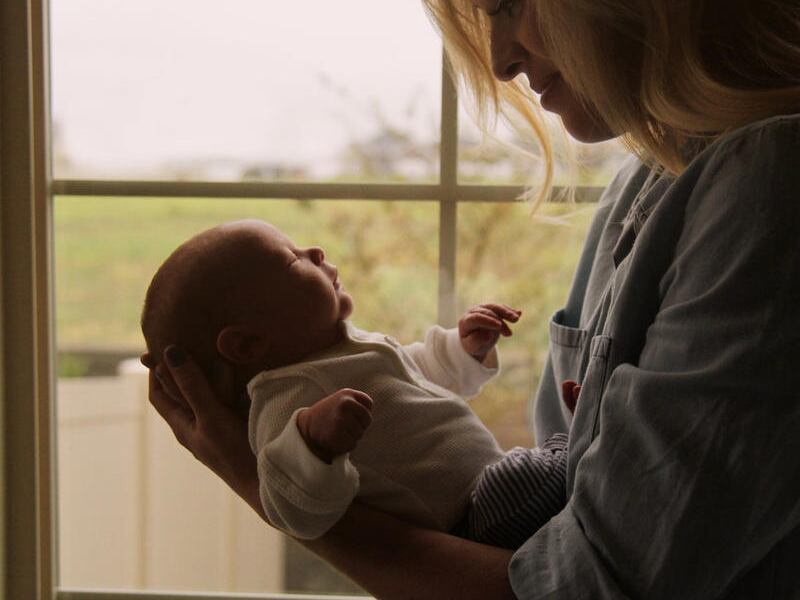 Carmen Rasmusen Herbert holds her youngest son shortly after he was born.