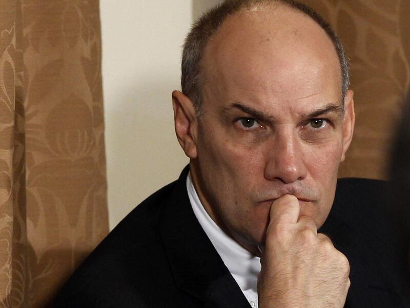 This Nov. 4, 2010 file photo shows Phil Schiliro, then-assistant to the President for Legislative Affairs, listening as President Barack Obama makes a statement to reporters after meeting with his staff and Cabinet members in the Cabinet Room at the White