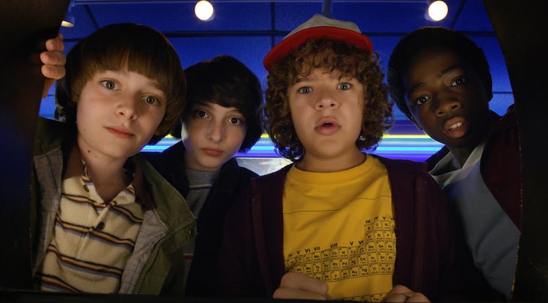 This image released by Netflix shows Noah Schnapp, from left, Finn Wolfhard, Gaten Matarazzo and Caleb Mclaughlin in a scene from “Stranger Things,” premiering its second season on Friday. (Netflix via AP)