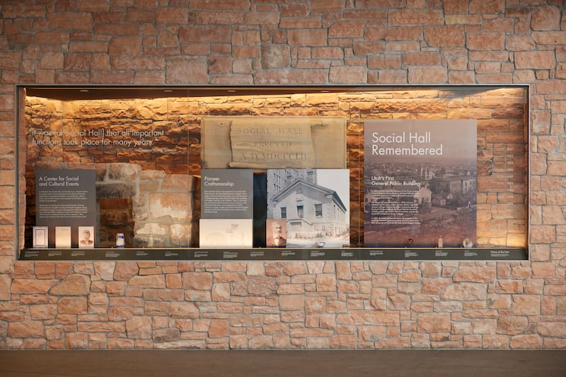 A memorial with remnants of the original structure is encased in an underground tunnel entrance to the buildings.