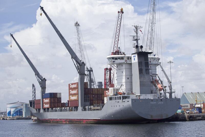 In this Wednesday, July 13, 2016, photo, the container ship Tropic Carib is shown docked at the Port of Palm Beach in Riviera Beach, Fla. On Friday, Aug. 5, the Commerce Department reports on the U.S. trade gap for June.