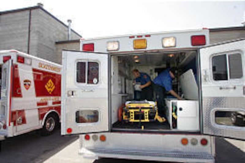 Jake Rigby, left, and Ryan Babinsky check inventory in one of Southwest Ambulance's new vehicles.