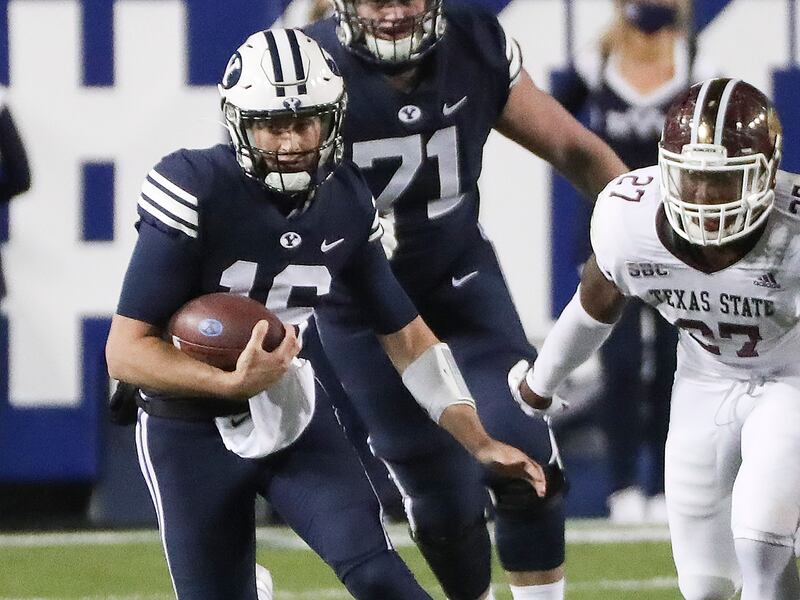 Baylor Romney scrambles during a game