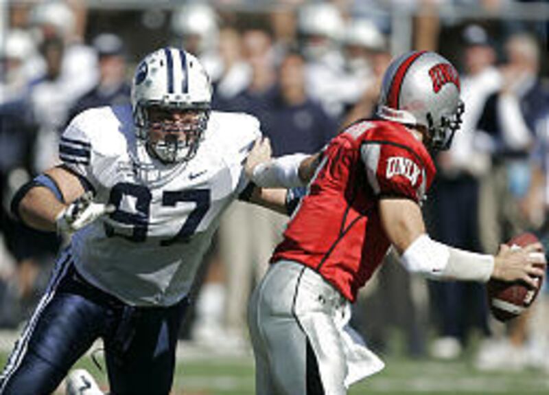 BYU's Justin Maddux sacks UNLV's Jarrod Jackson Saturday in BYU's 55-14 win.